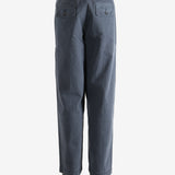 Grey pants worn by a person, showing the pants' fit