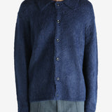 Navy cardigan worn by a person, showing the cardigan's fit