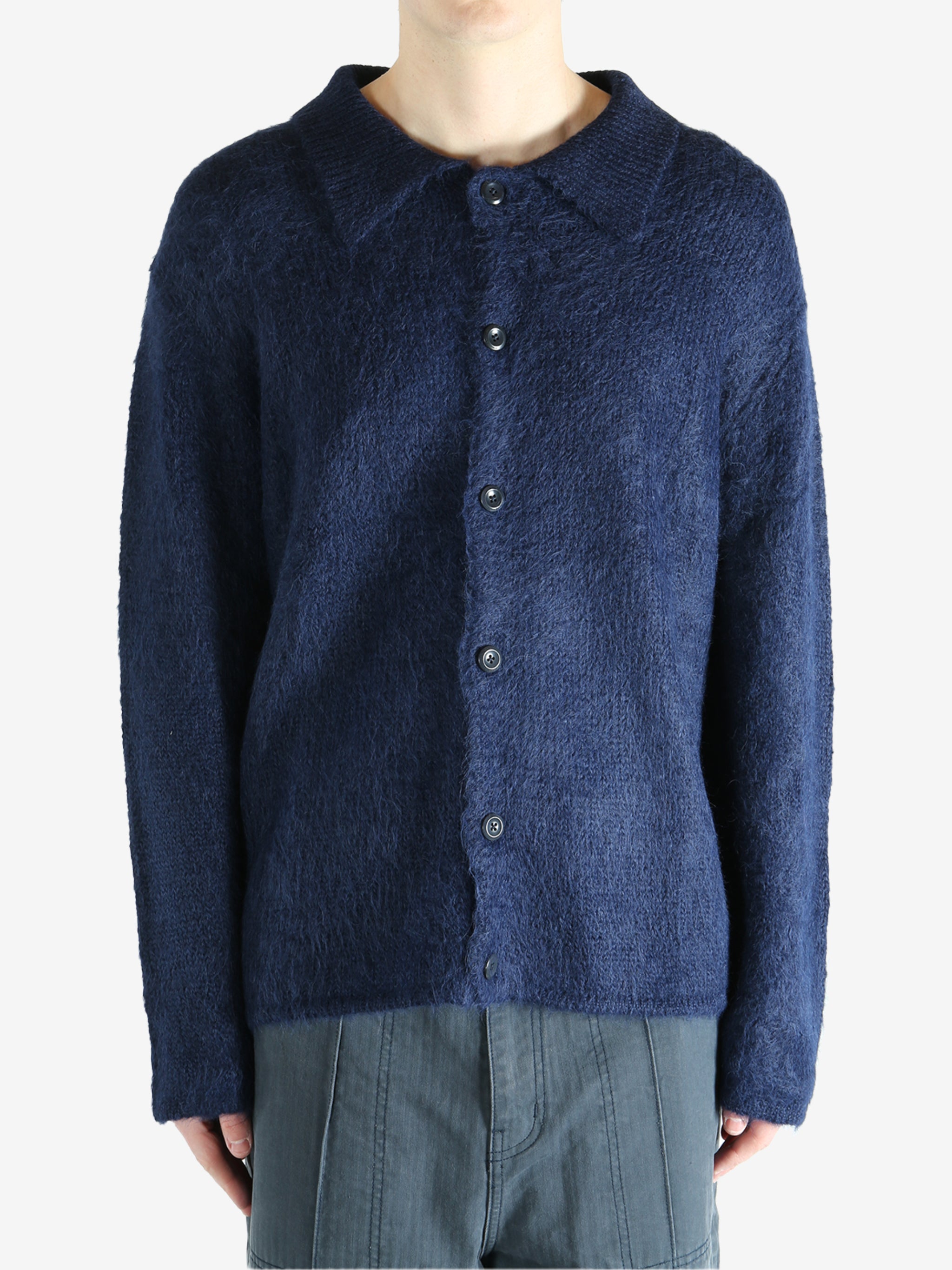 Navy cardigan worn by a person, showing the cardigan's fit