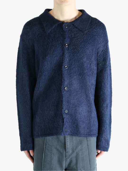 Navy cardigan worn by a person, showing the cardigan's fit