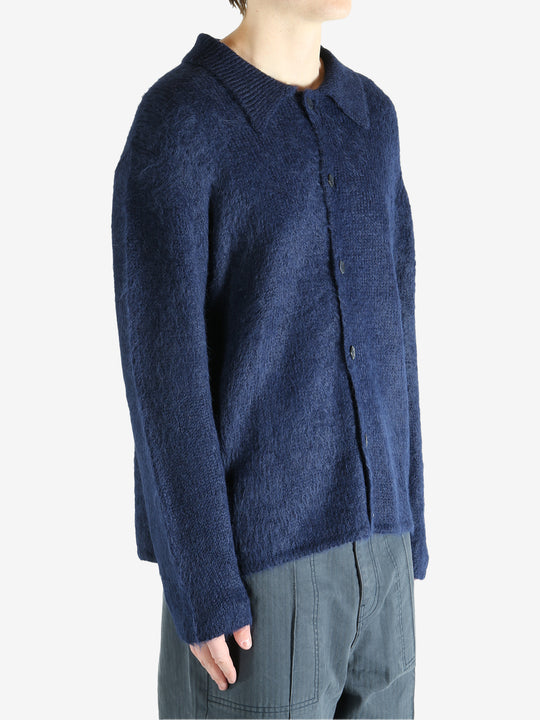 Navy cardigan worn by a person, showing the cardigan's fit