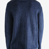 Navy cardigan worn by a person, showing the cardigan's fit