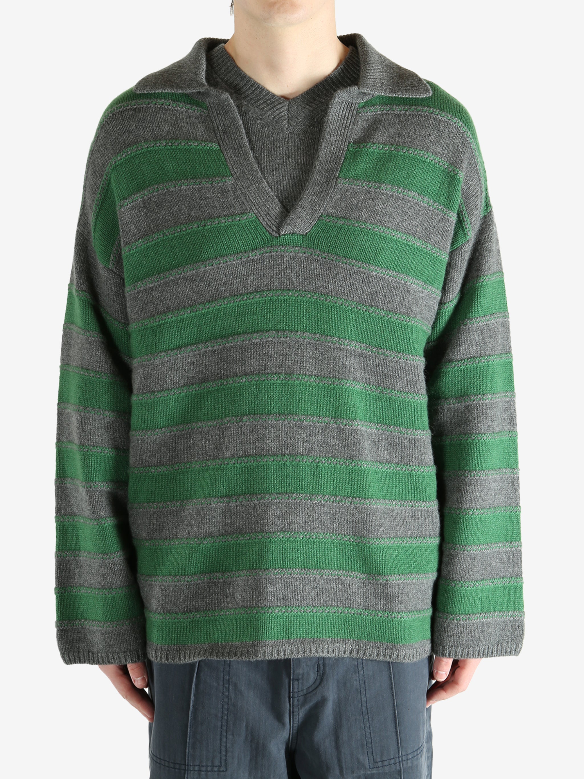 Green shirt worn by a person, showing the shirt fit