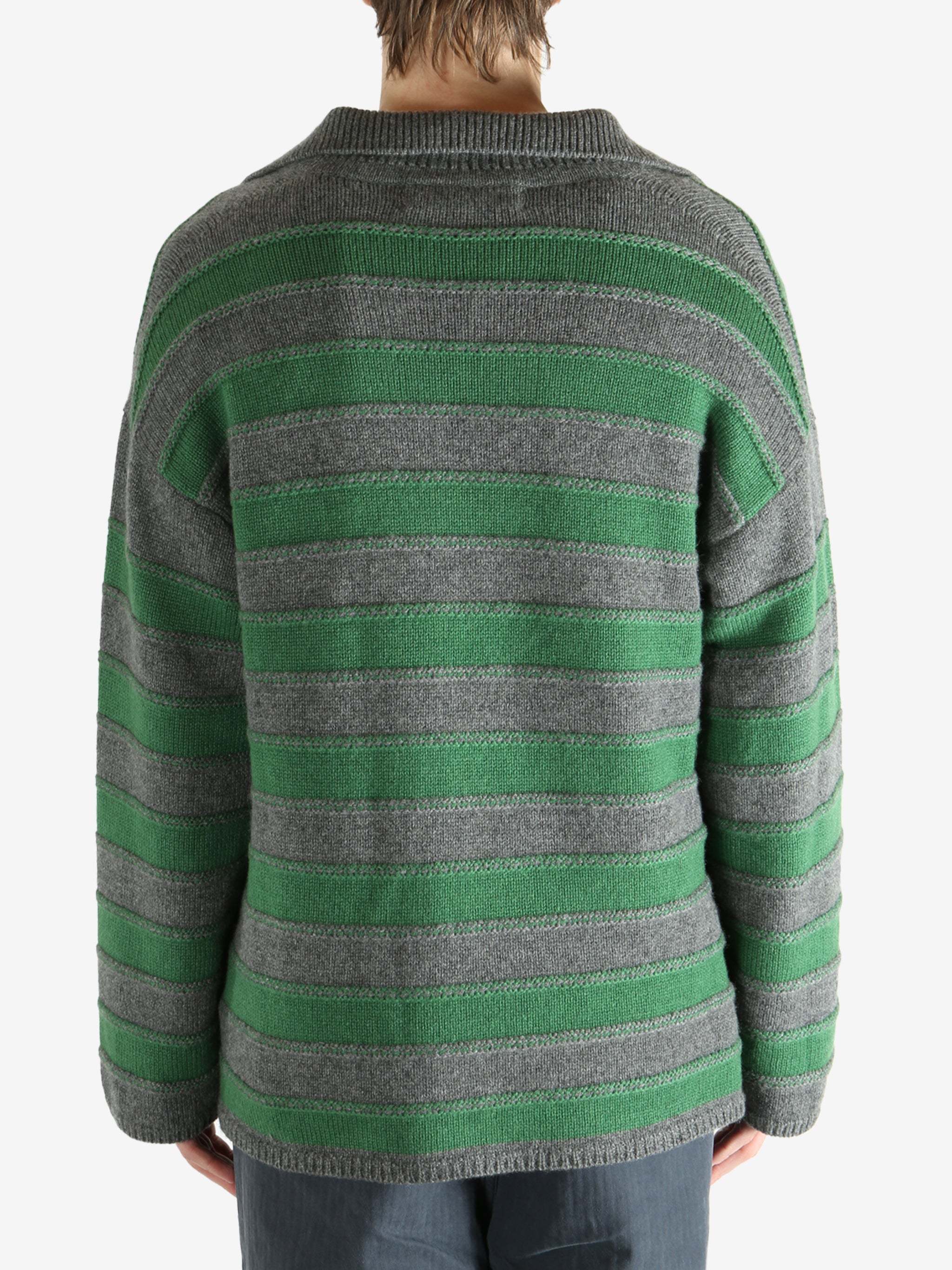 Green shirt worn by a person, showing the shirt fit