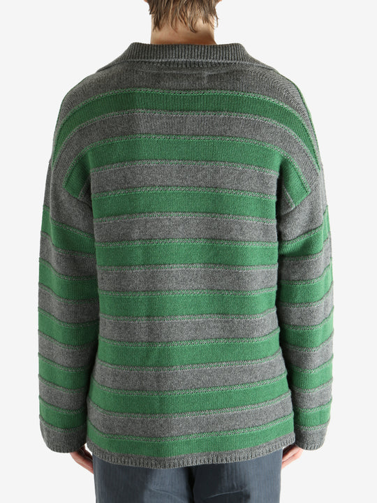 Green shirt worn by a person, showing the shirt fit