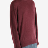 Red sweater worn by a person, showing the sweater fit