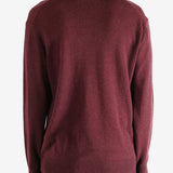 Red sweater worn by a person, showing the sweater fit