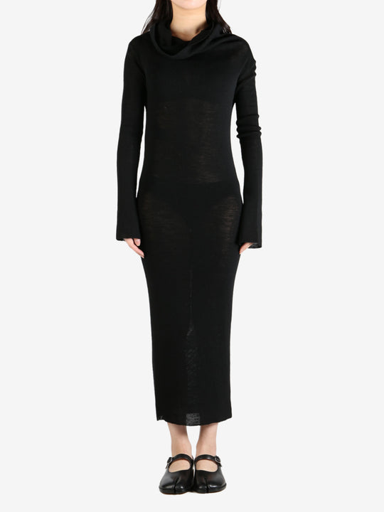 Black dress worn by a person, showing the dress's fit