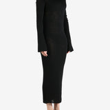 Black dress worn by a person, showing the dress's fit