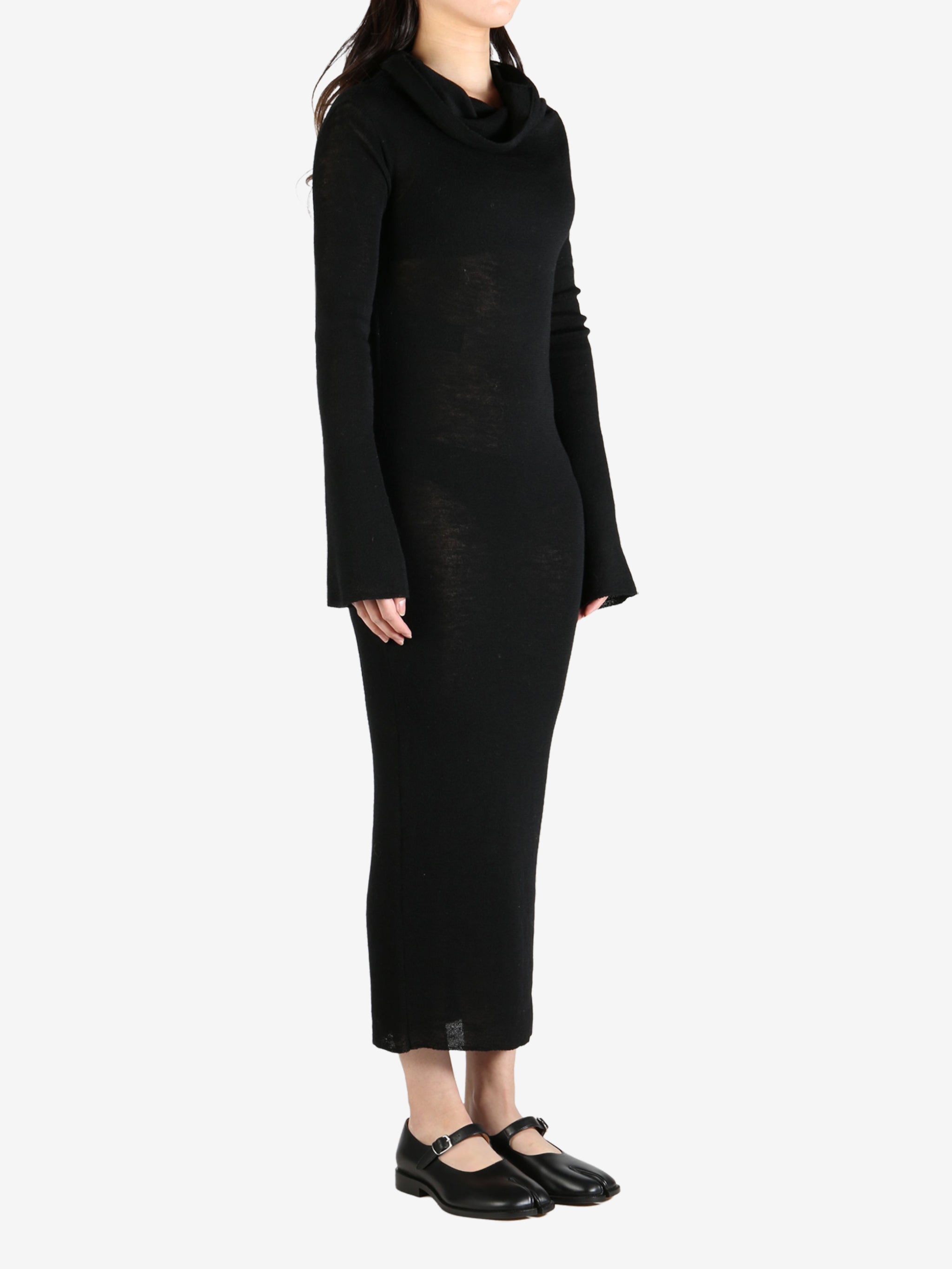 Black dress worn by a person, showing the dress's fit