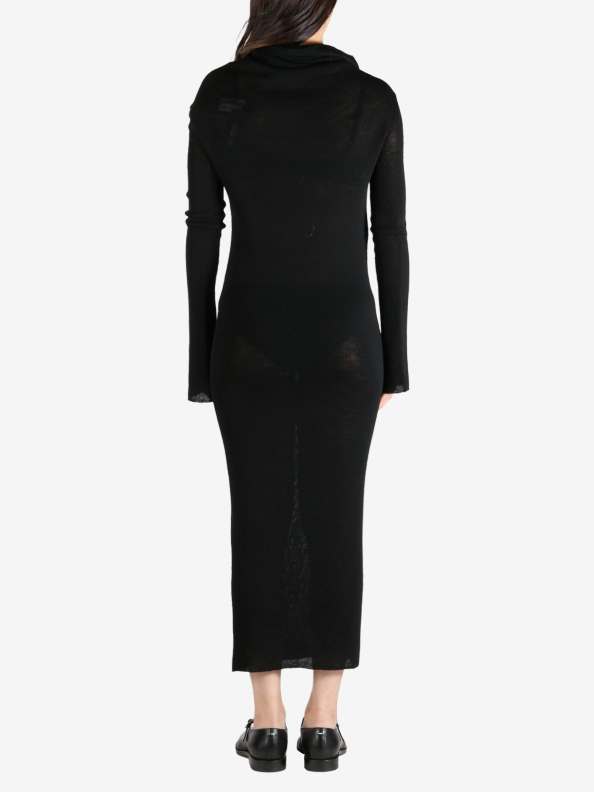 Black dress worn by a person, showing the dress's fit