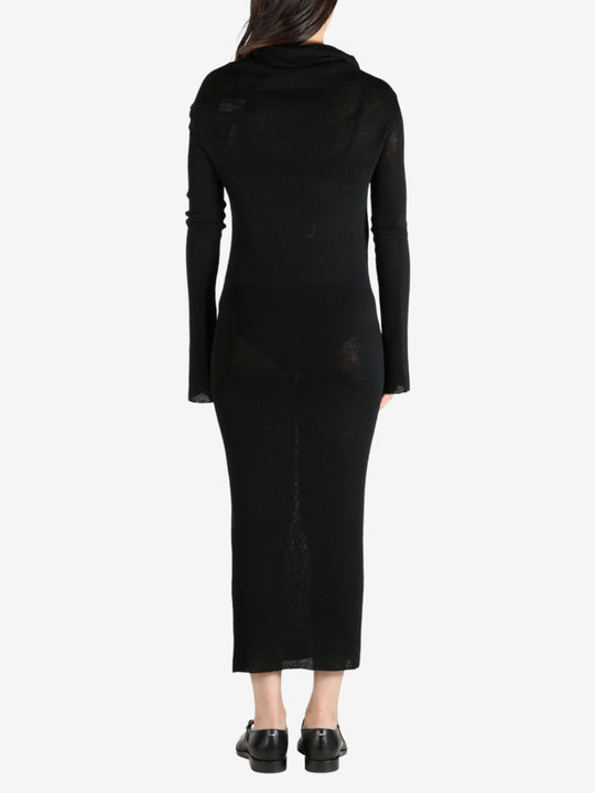 Black dress worn by a person, showing the dress's fit