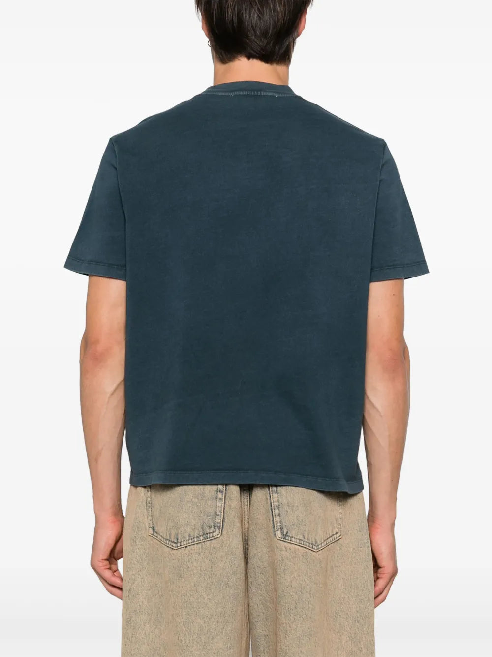 Blue shirt worn by a person, showing the shirt's fit