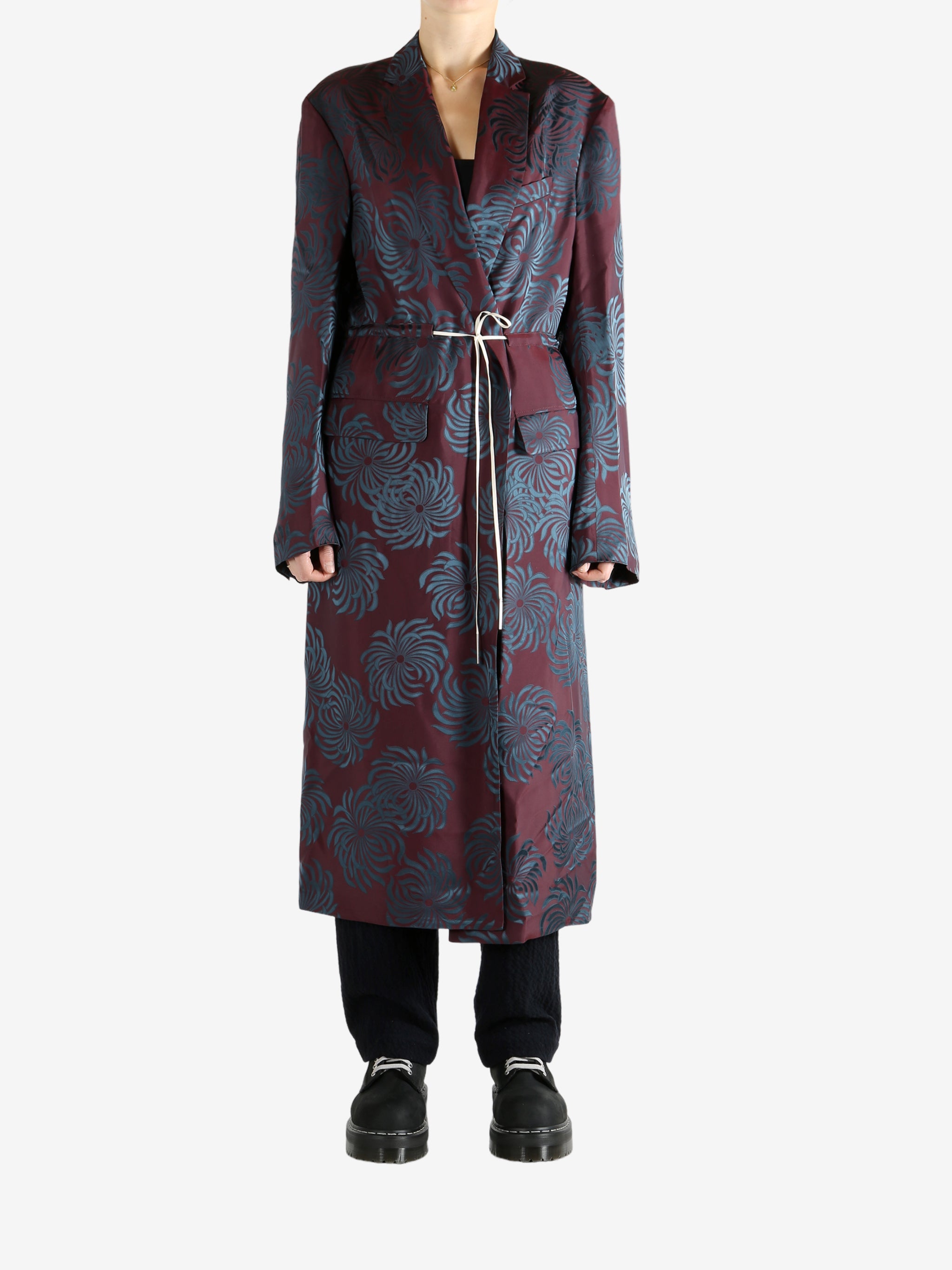 Burgundy coat worn by a person, showing the coat's fit