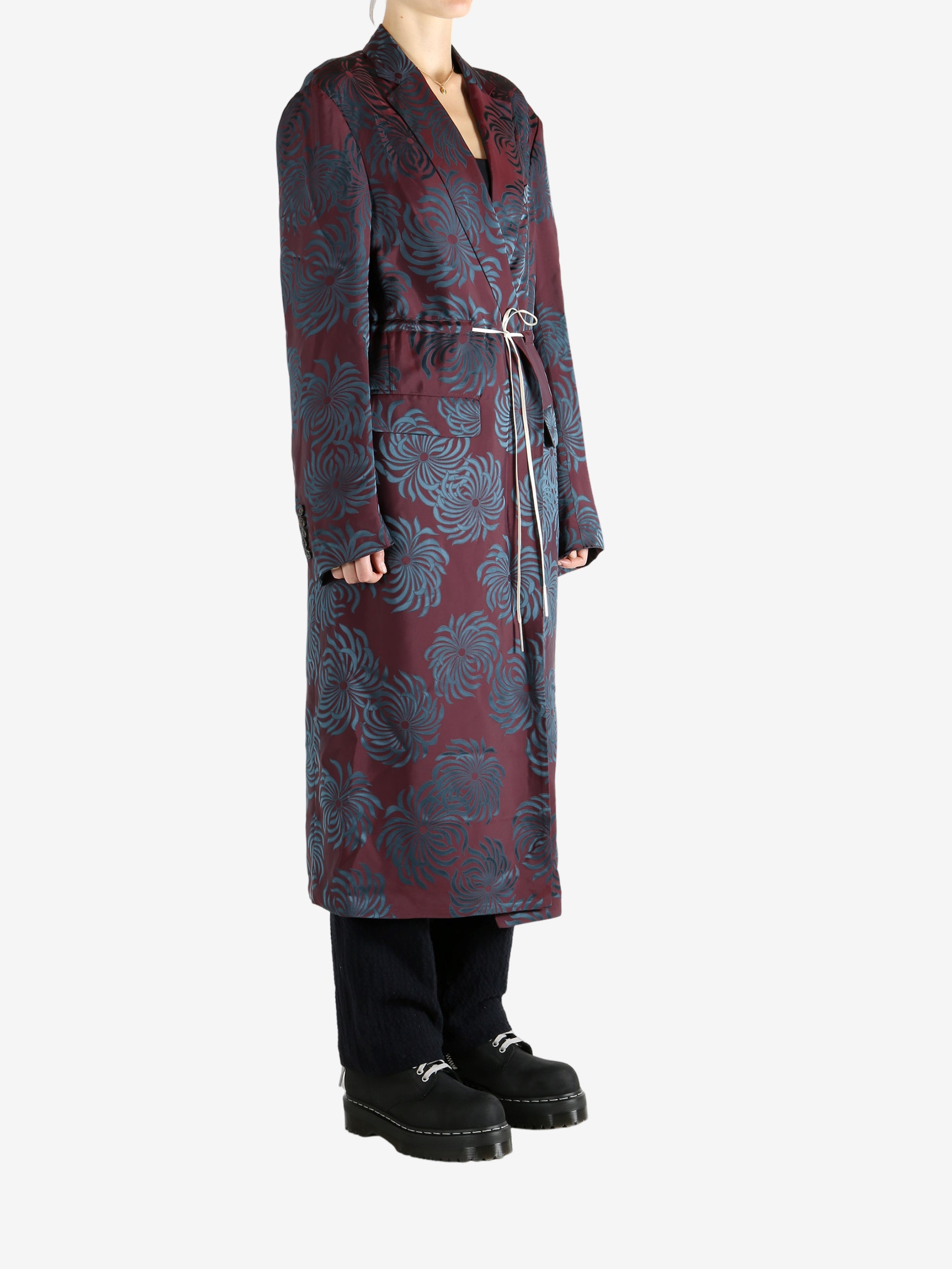 Burgundy coat worn by a person, showing the coat's fit