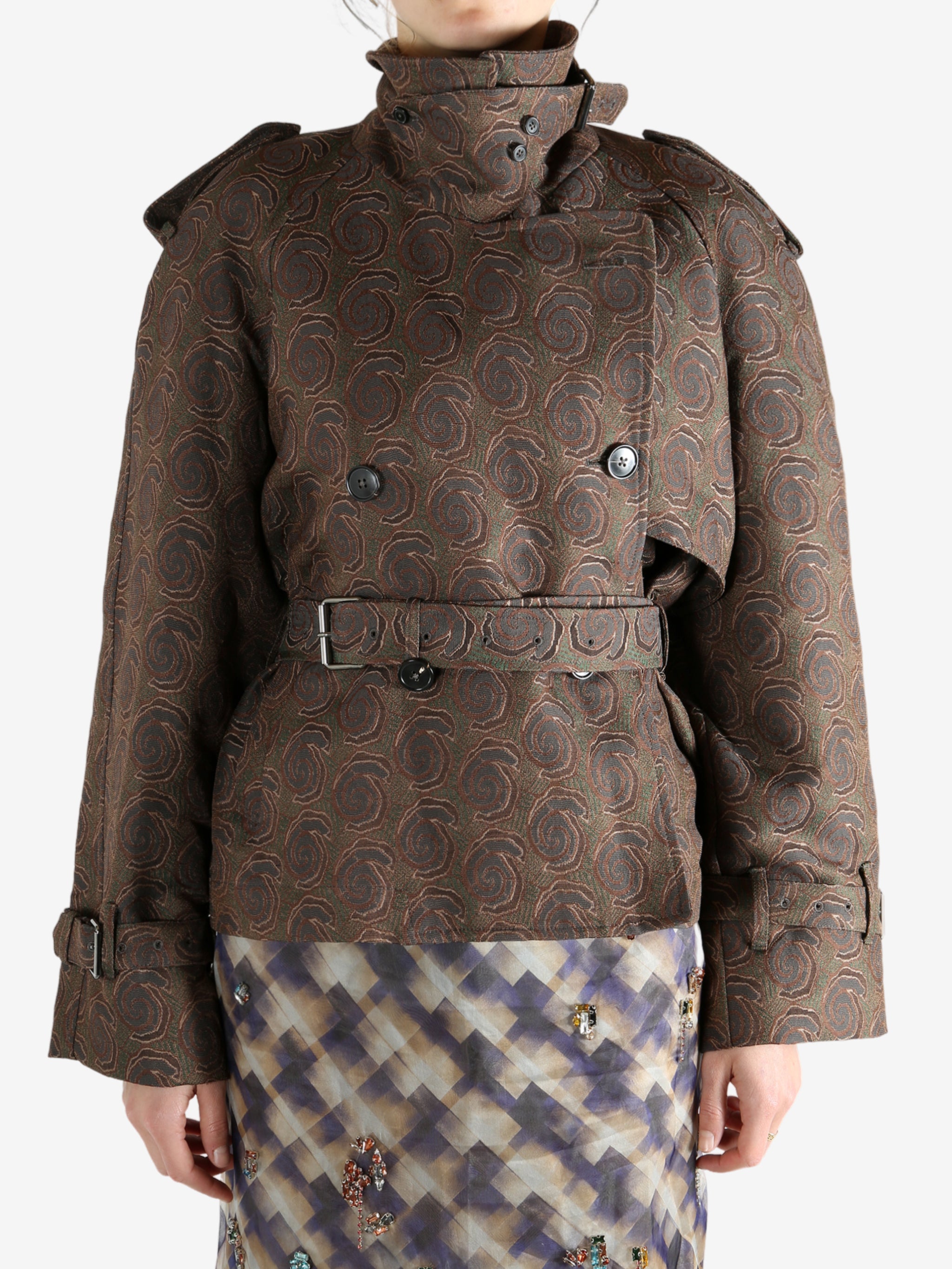 Brown coat worn by a person, showing the coat's fit