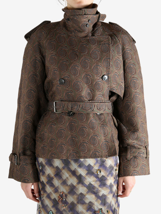 Brown coat worn by a person, showing the coat's fit