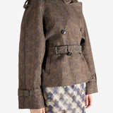 Brown coat worn by a person, showing the coat's fit