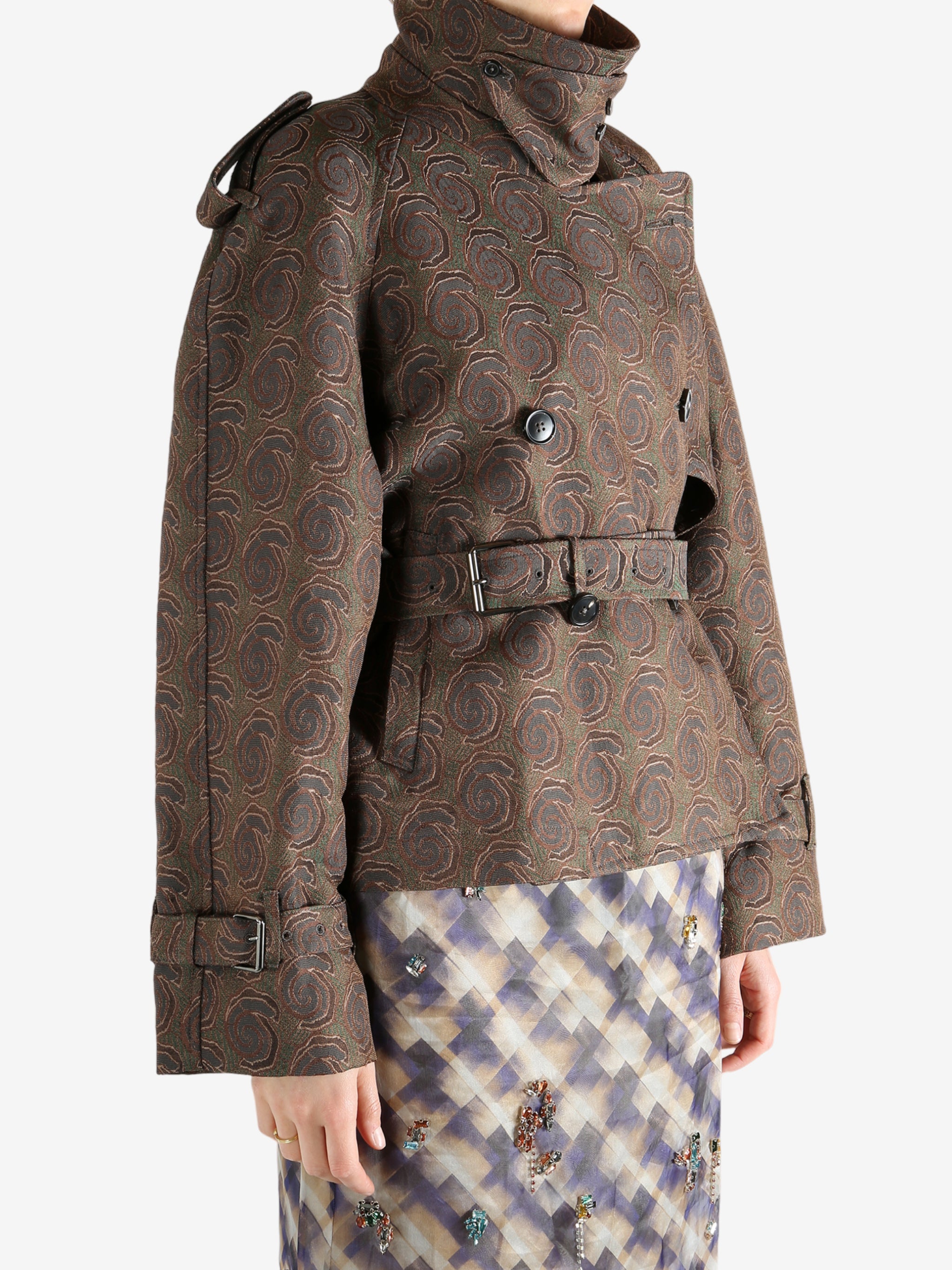 Brown coat worn by a person, showing the coat's fit