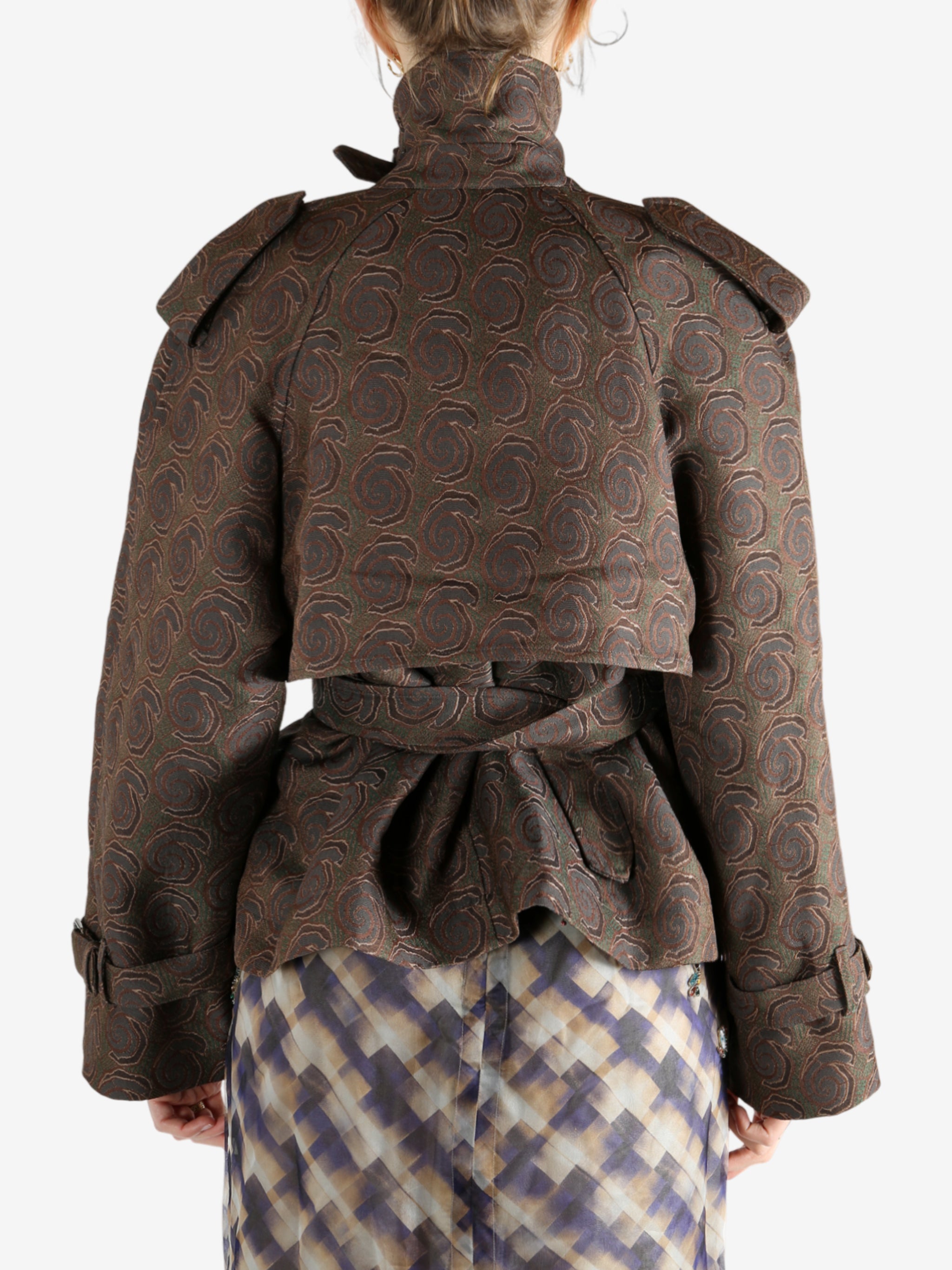 Brown coat worn by a person, showing the coat's fit