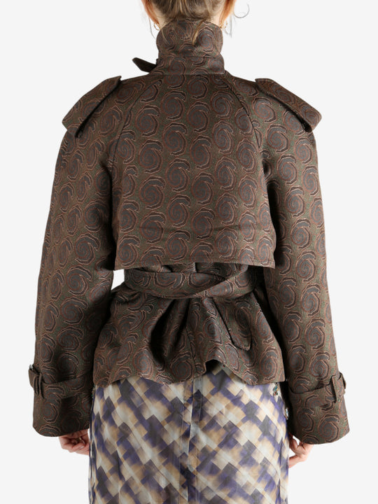 Brown coat worn by a person, showing the coat's fit