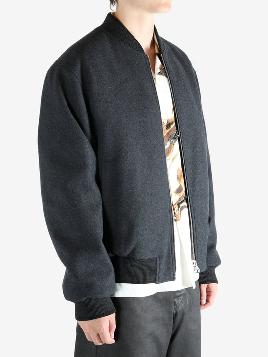 Gray jacket worn by a person, showing the jacket's fit