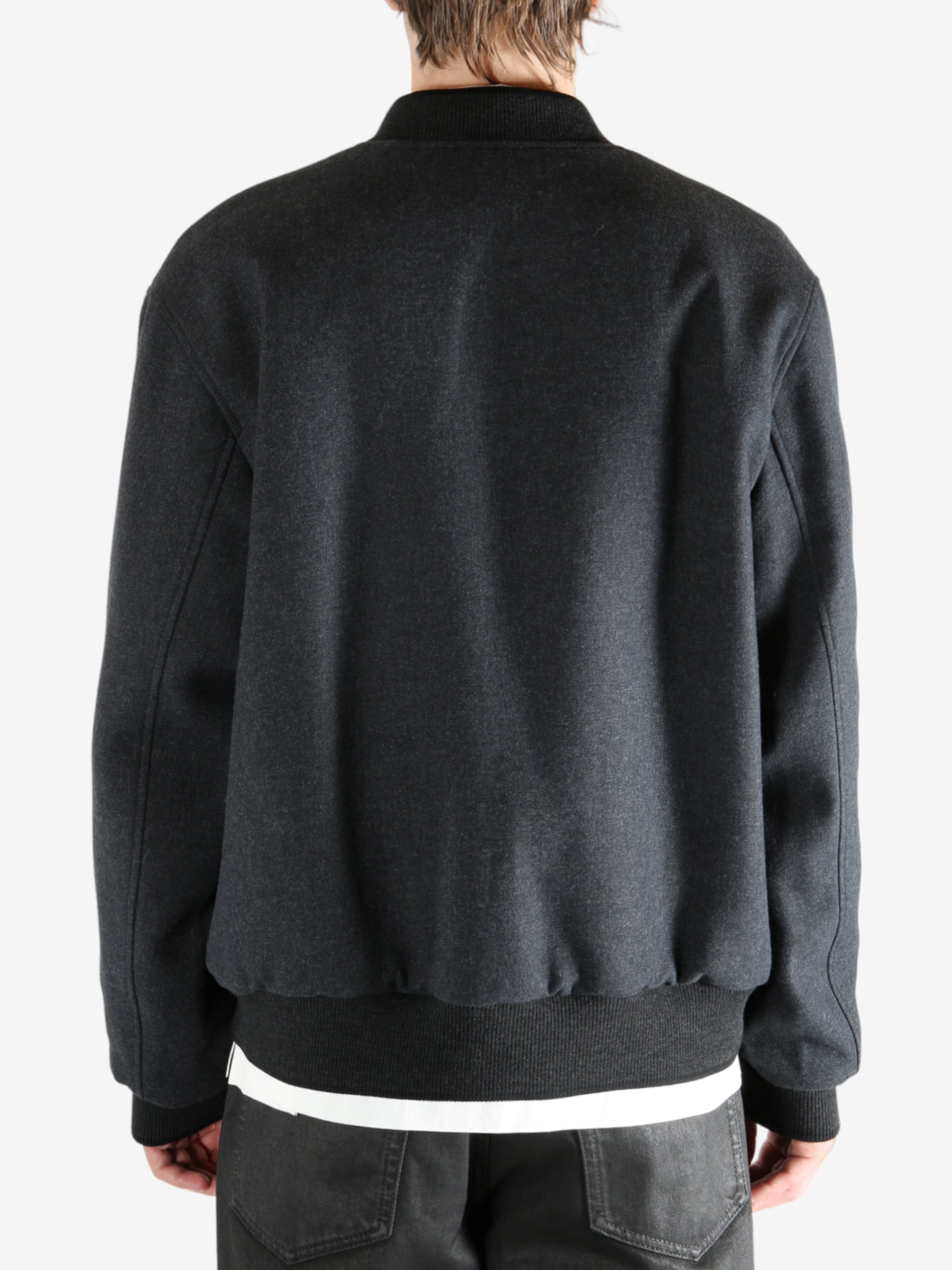 Gray jacket worn by a person, showing the jacket's fit