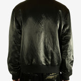 Green bomber jacket worn by a person,showing the jacket fit