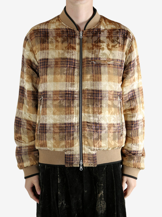 Yellow bomber jacket worn by a person,showing the jacket fit