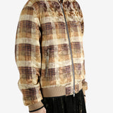 Yellow bomber jacket worn by a person,showing the jacket fit