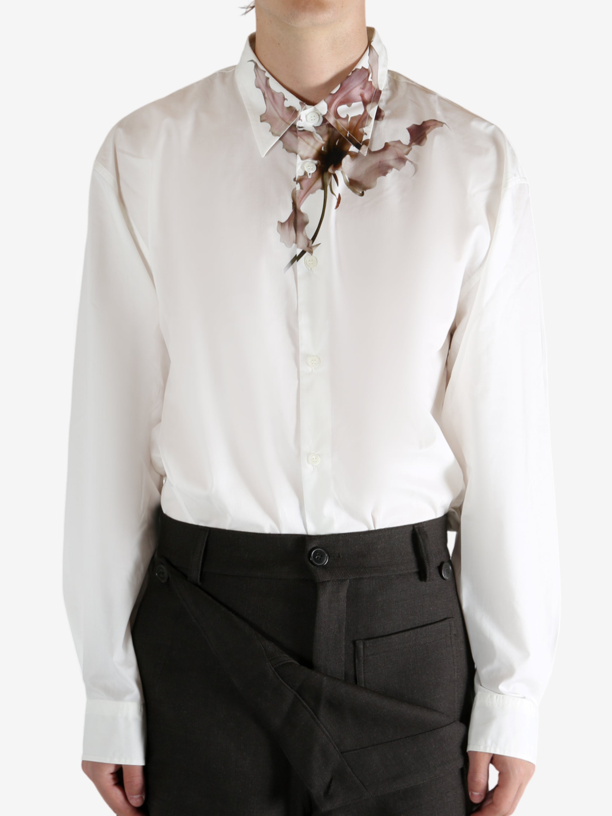 White shirt worn by a person, showing the shirt's fit