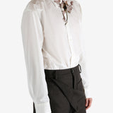 White shirt worn by a person, showing the shirt's fit