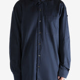 Navy shirt worn by a person, showing the shirt's fit