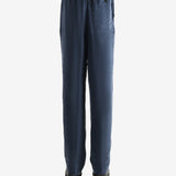 Navy pant worn by a person, showing the pant's fit