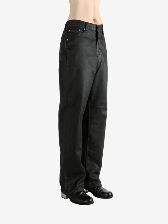 Black pants worn by a person, showing the pants' fit