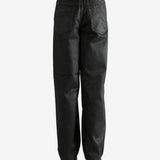 Black pants worn by a person, showing the pants' fit
