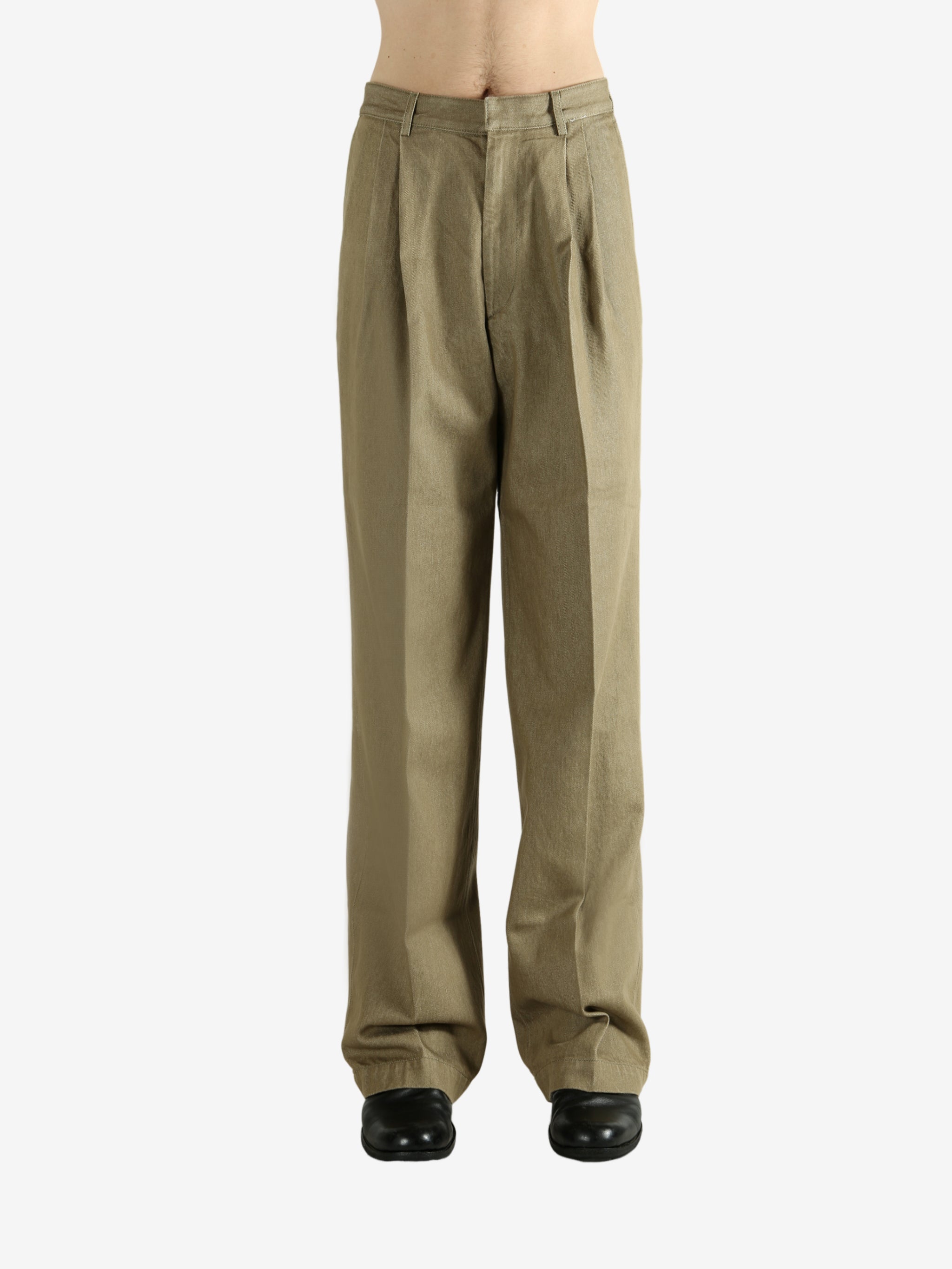 Tan pants worn by a person, showing the pants' fit