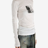 White t-shirt worn by a person, showing the shirt's fit