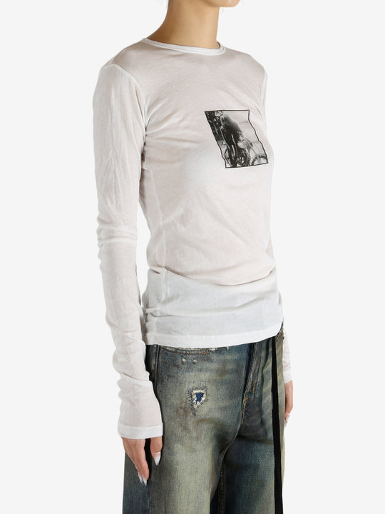 White t-shirt worn by a person, showing the shirt's fit