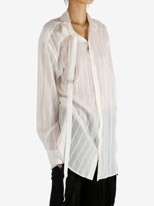 White shirt worn by a person, showing the shirt's fit