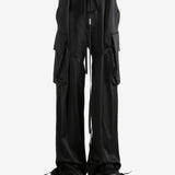 Black pants worn by a person, showing the pants' fit