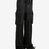 Black pants worn by a person, showing the pants' fit