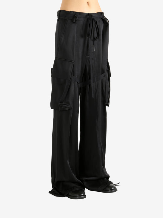 Black pants worn by a person, showing the pants' fit