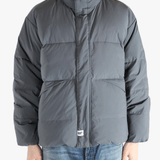 Grey jeaket worn by a person, showing the jeaket fit