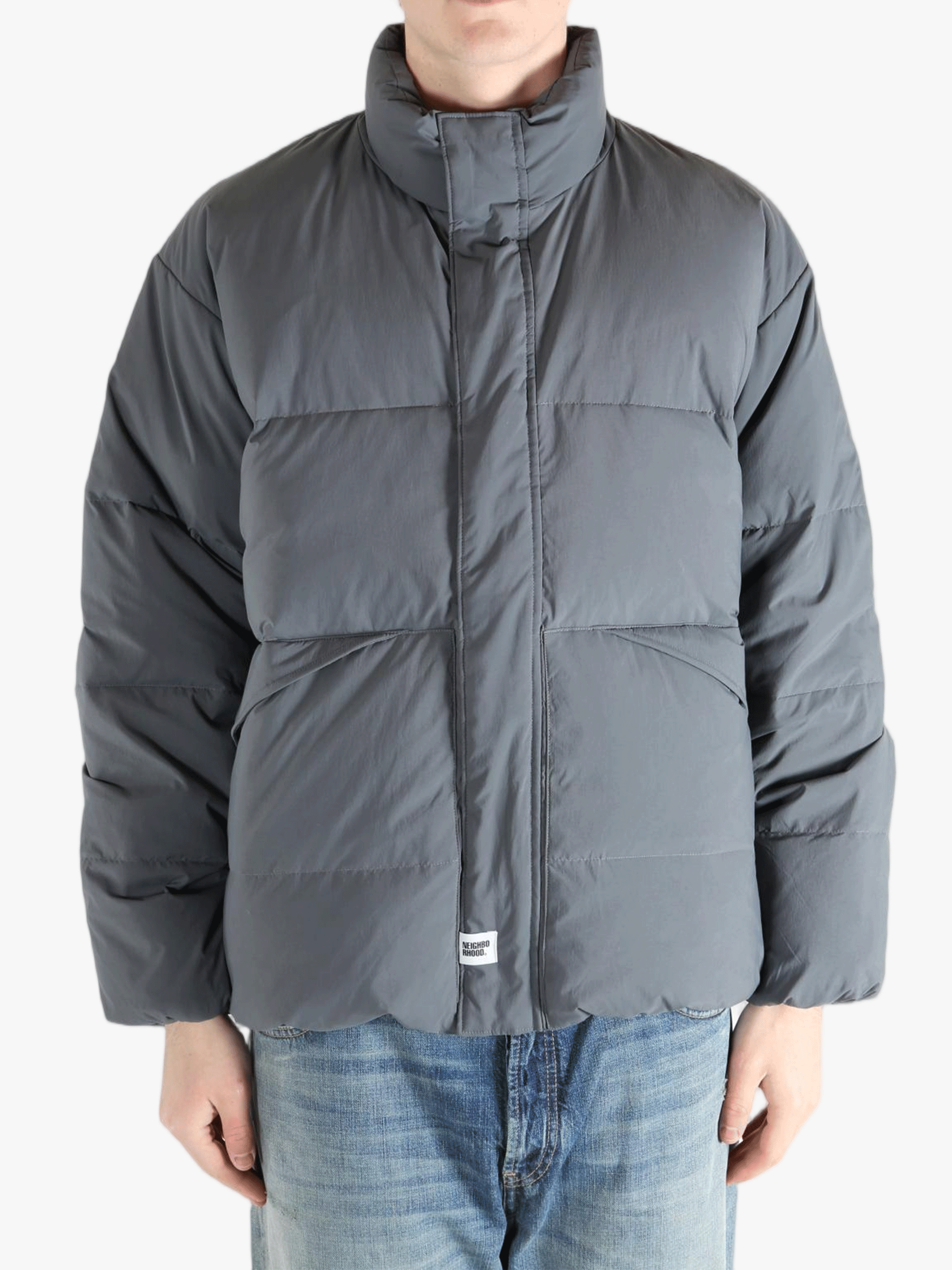 Grey jeaket worn by a person, showing the jeaket fit