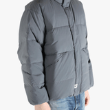 Grey jeaket worn by a person, showing the jeaket fit