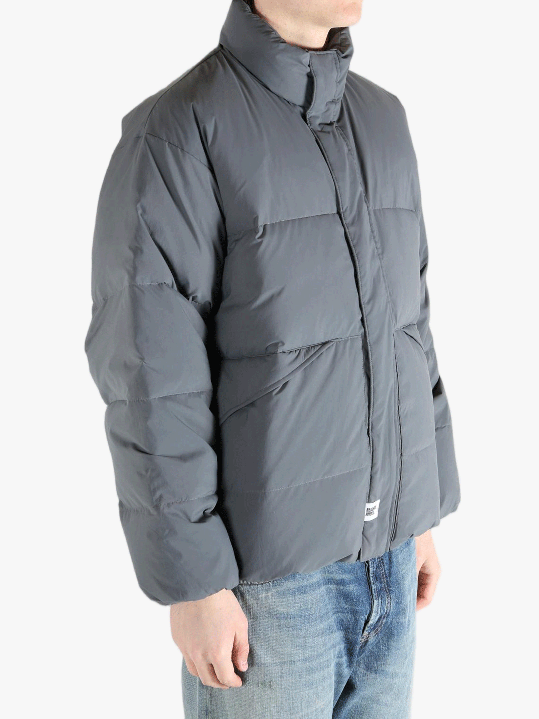 Grey jeaket worn by a person, showing the jeaket fit