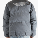 Grey jeaket worn by a person, showing the jeaket fit