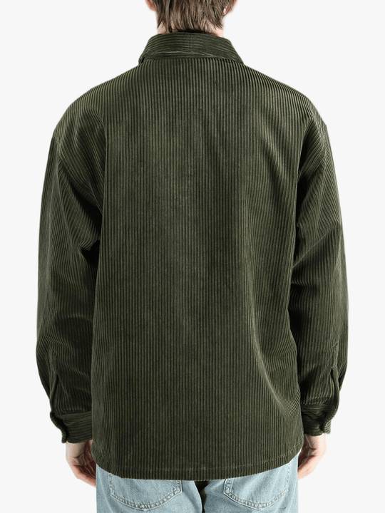 Green shirt worn by a person, showing the shirt's fit