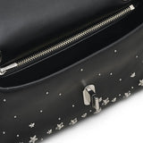 Close up of black bag,showing texture of the leather fabric.